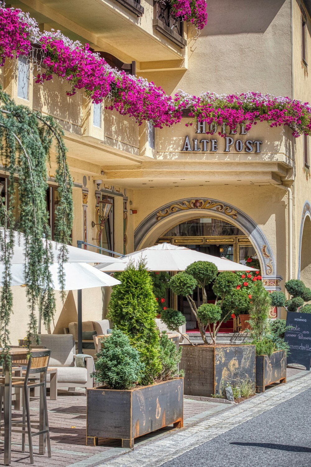 Entrance of Hotel Alte Post with a hotel sign