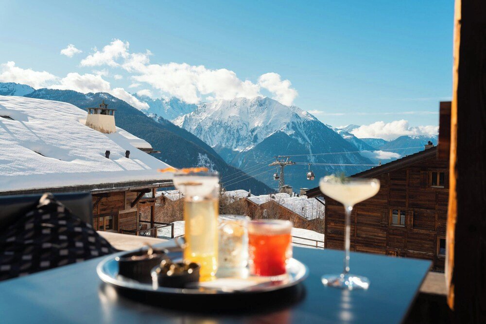 Table with drinks in the lounge of W Verbier hotel